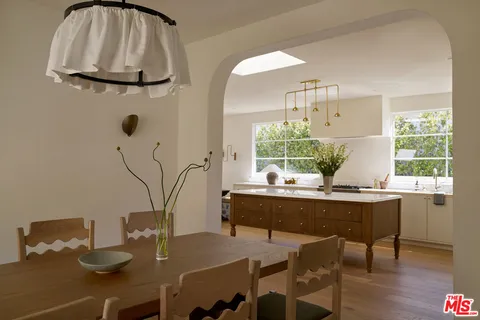 a view of a dining room with furniture and window