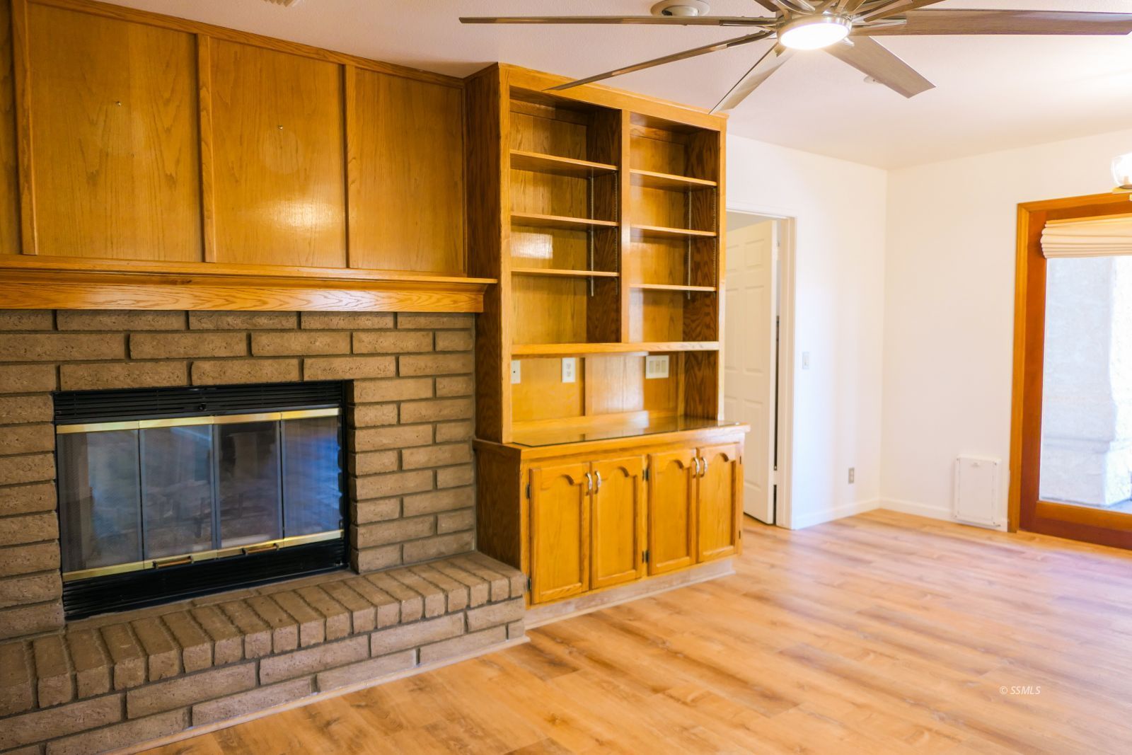 925 Hermosa Avenue Ridgecrest, CA 93555 - Photo 10 of 50 a view of an empty room with a fireplace and a window