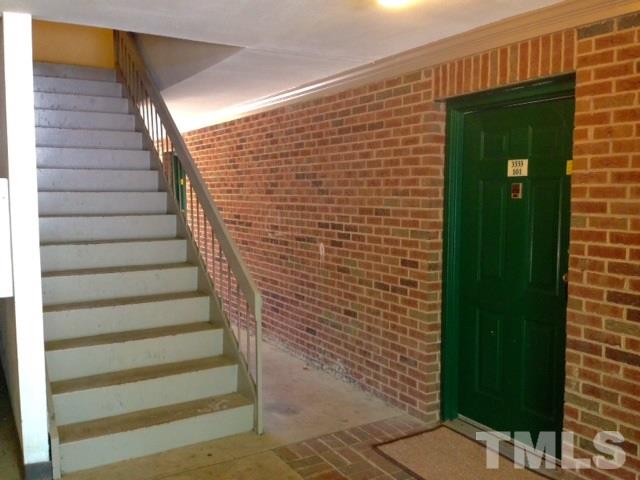 3533 Ivy Commons Drive, Unit 101 Raleigh, NC 27606 - Photo 8 of 9 a view of entryway with a door