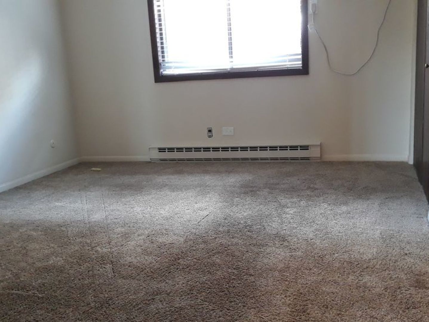 955 North Rohlwing Road, Unit 101A Addison, IL 60101 - Photo 11 of 13 a view of a room that has a window in it