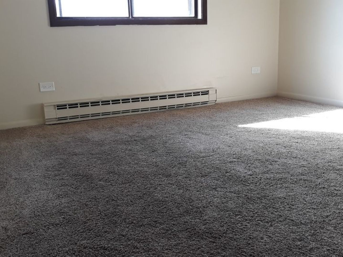 955 North Rohlwing Road, Unit 101A Addison, IL 60101 - Photo 12 of 13 a view of a room with racks on the wall