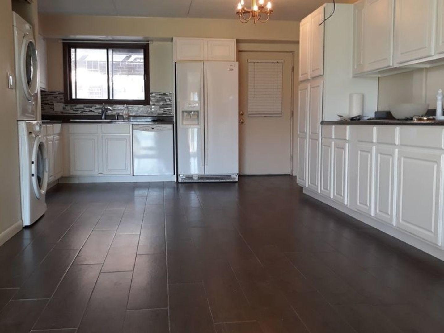 955 North Rohlwing Road, Unit 101A Addison, IL 60101 - Photo 2 of 13 a kitchen with stainless steel appliances granite countertop a stove a sink and a refrigerator
