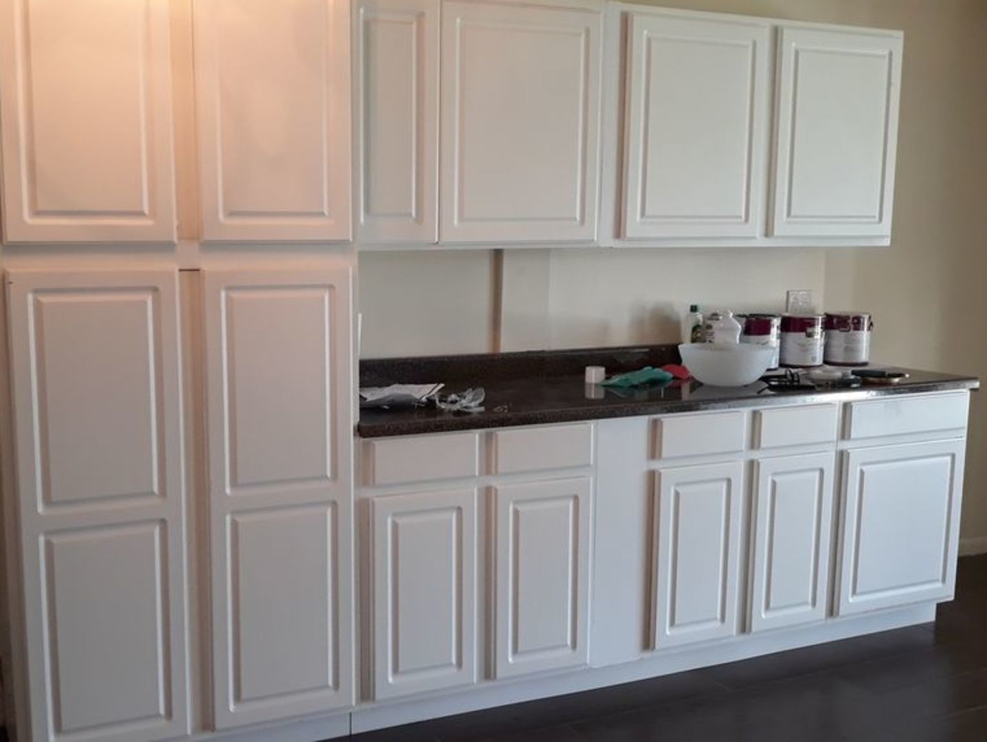 955 North Rohlwing Road, Unit 101A Addison, IL 60101 - Photo 5 of 13 a kitchen with white cabinets and a sink