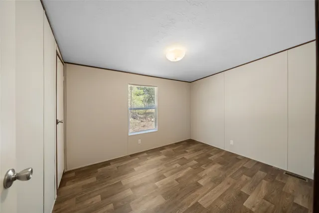 an empty room with a empty space and window