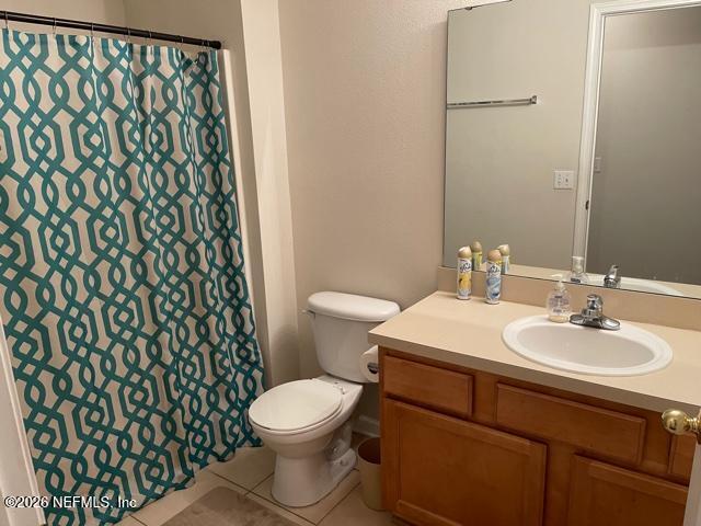 7920 Merrill Road, Unit 2004 Jacksonville, FL 32277 - Photo 9 of 13 a bathroom with a sink and a toilet