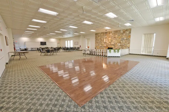 a view of a living room and kitchen