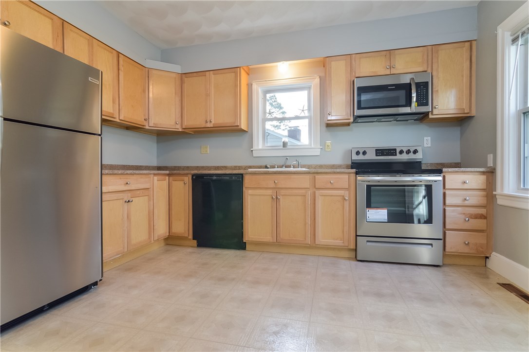 102 Davidson Road Warwick, RI 02886 - Photo 13 of 37 Spacious eat-in kitchen with brand new refrigerator, range and microwave.