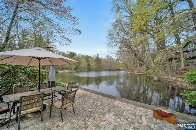a view of backyard of house with seating space