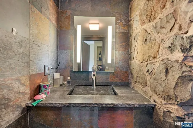 a view of a dining room with furniture large windows and wooden floor