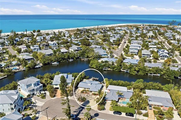 an aerial view of a house with a lake view