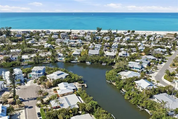 an aerial view of a house with a lake view