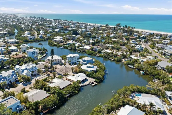 an aerial view of a house with a lake view