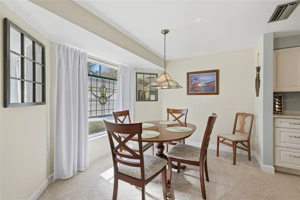 a view of a dining room with furniture