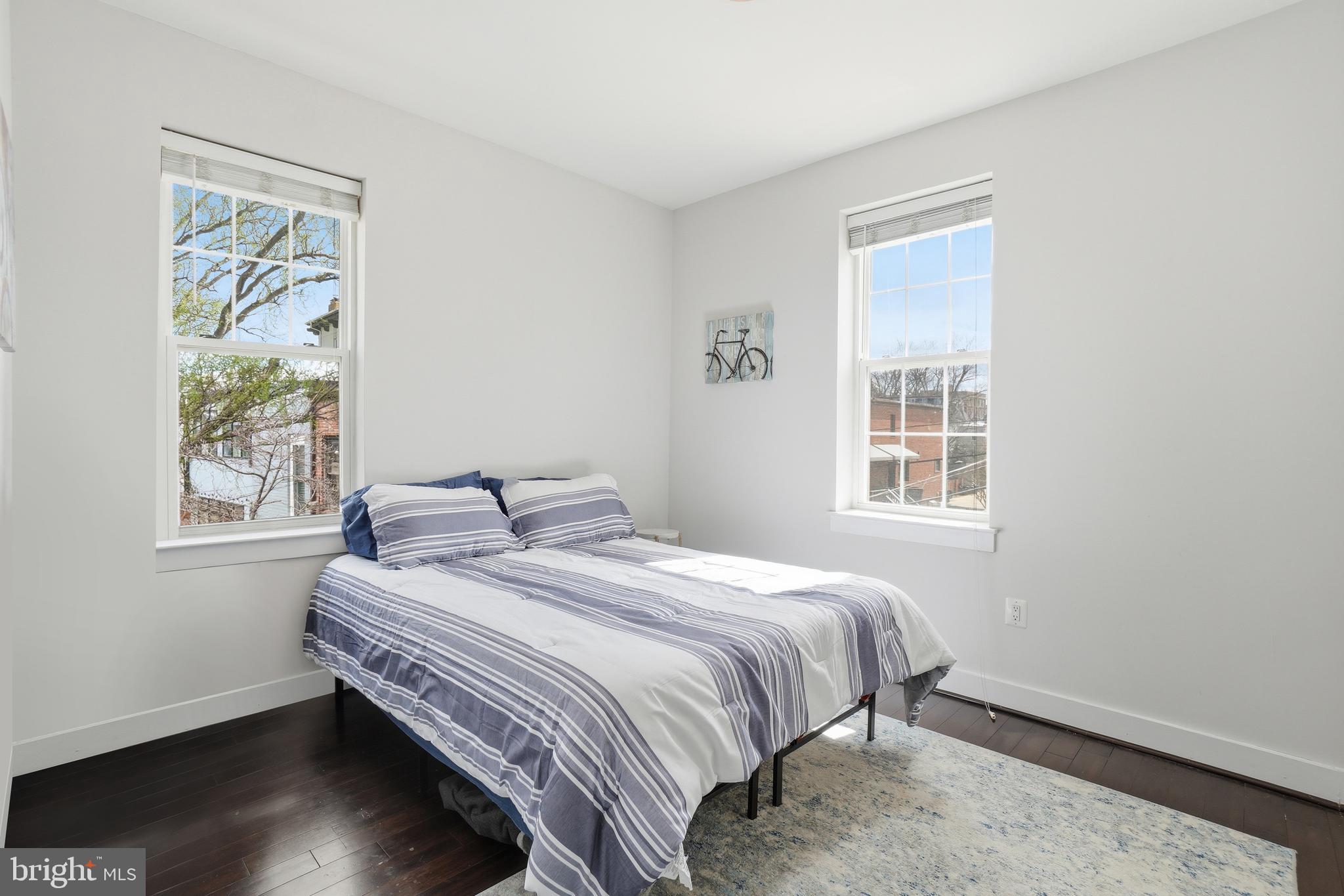315 G Street Northeast, Unit 306 Washington, DC 20002 - Photo 11 of 14 a bedroom with a bed and a window