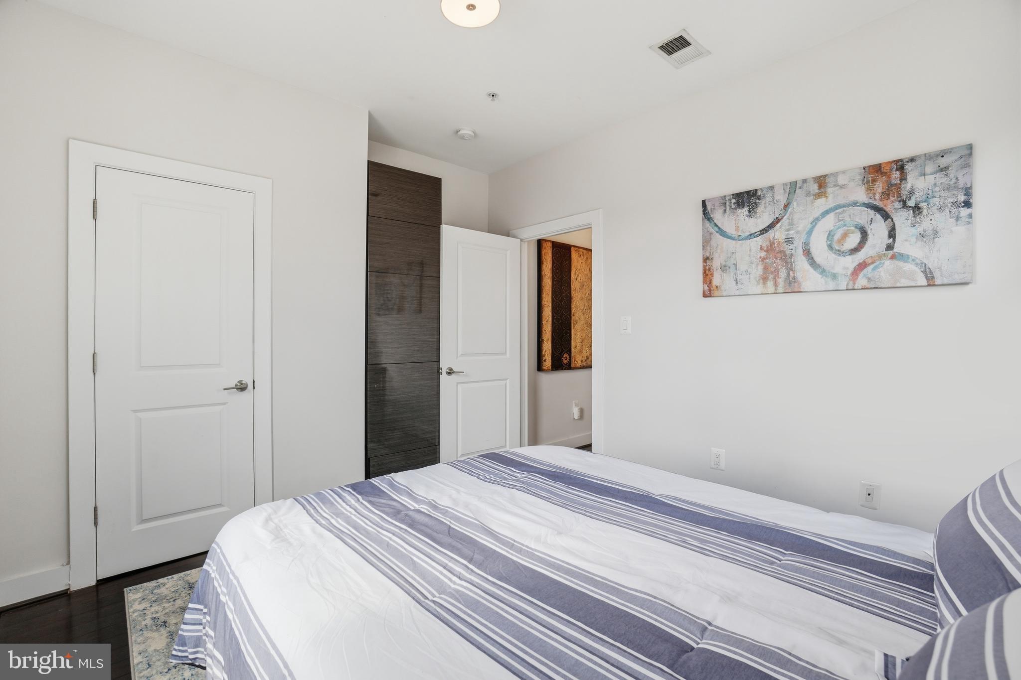 315 G Street Northeast, Unit 306 Washington, DC 20002 - Photo 12 of 14 a bedroom with a bed and a window