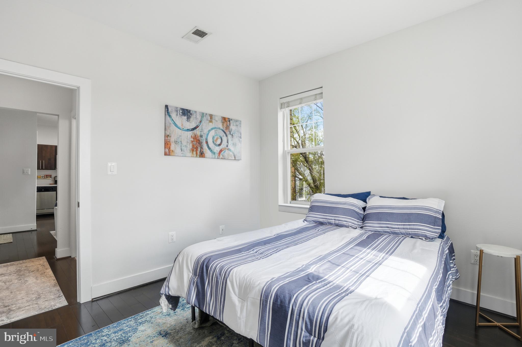 315 G Street Northeast, Unit 306 Washington, DC 20002 - Photo 10 of 14 a bedroom with a bed and a window