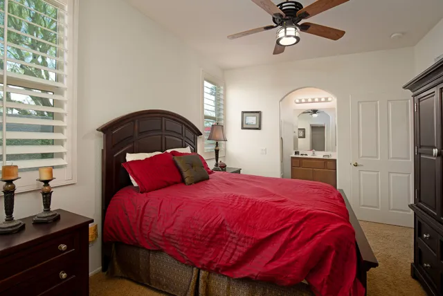 a bedroom with a bed and a closet