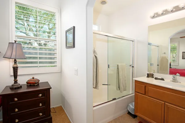 a room with a bed and a dresser