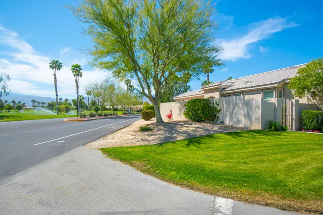 a view of a patio with a fountain