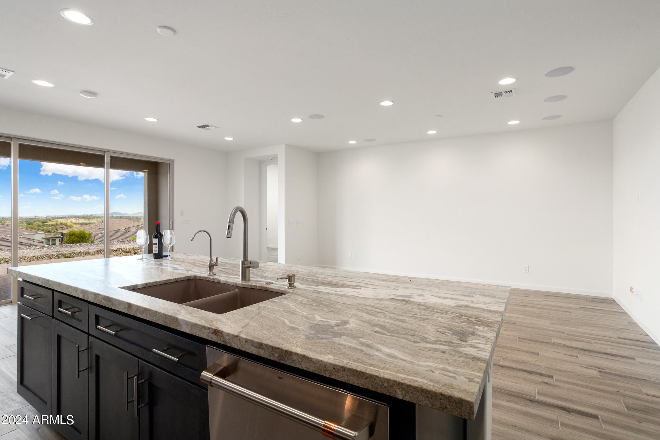 4092 Prairie Schooner Road Wickenburg, AZ 85390 - Photo 17 of 30 a view of a kitchen with a sink and cabinets