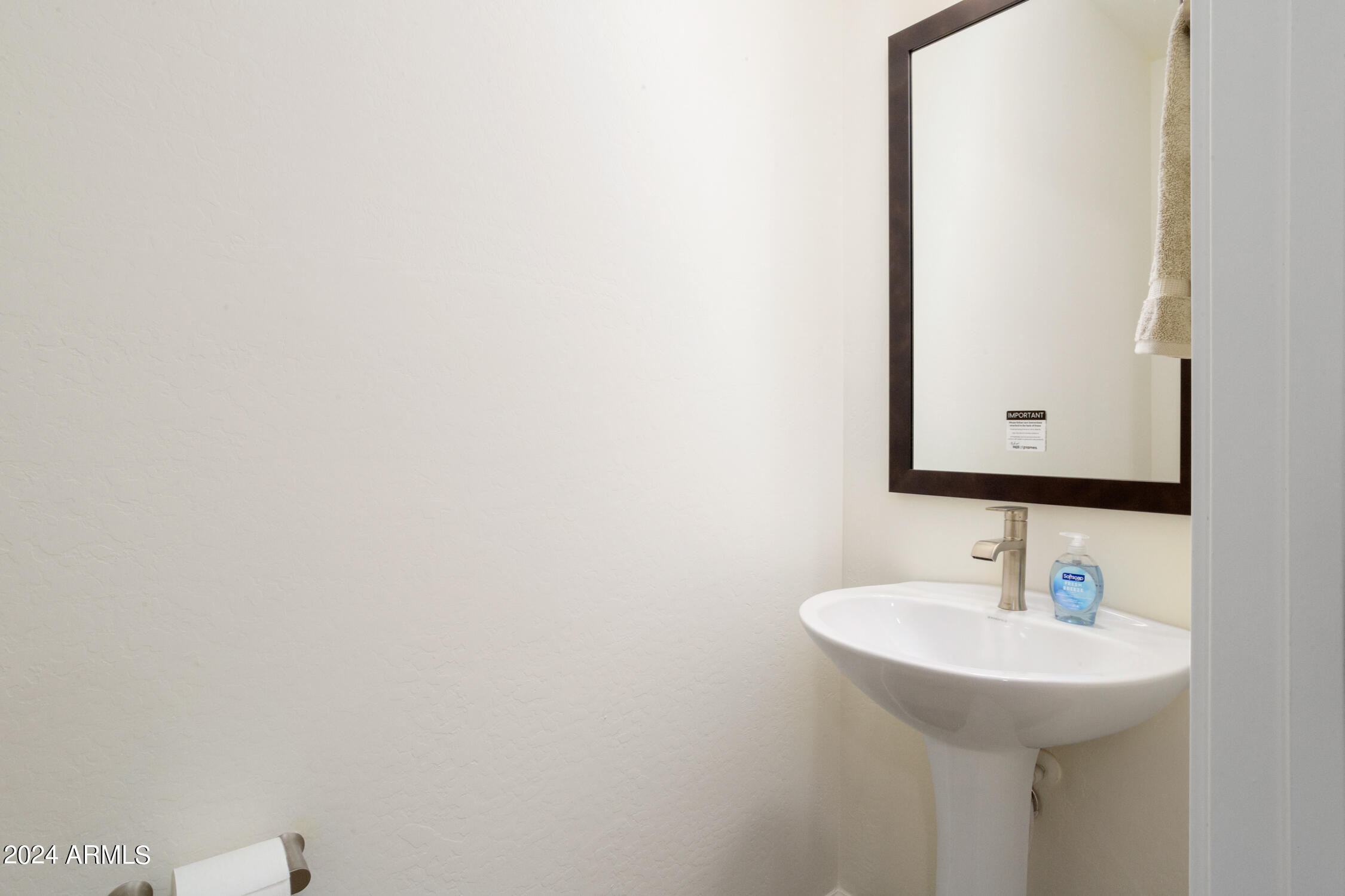 4092 Prairie Schooner Road Wickenburg, AZ 85390 - Photo 18 of 30 a bathroom with a sink and a mirror