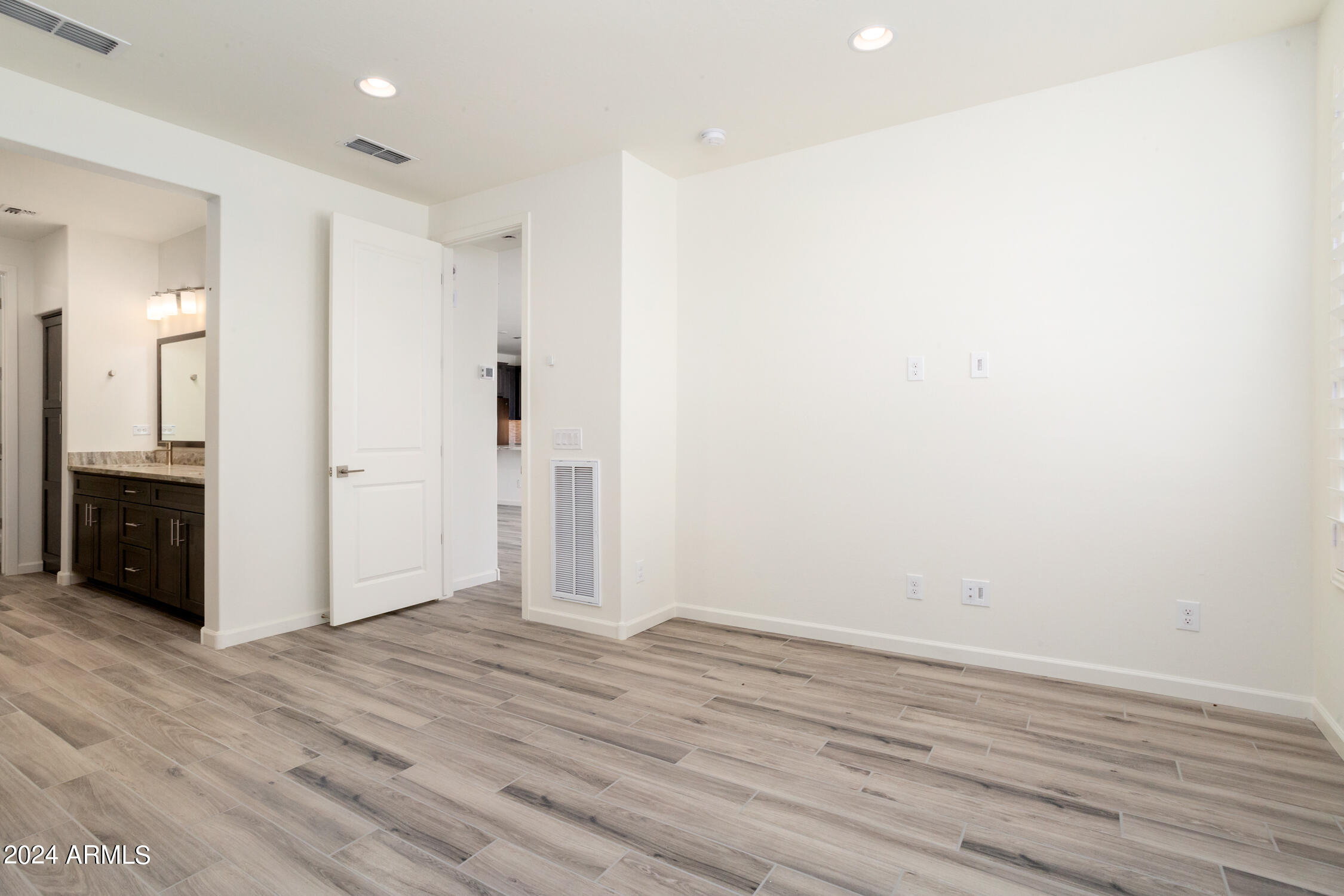 4092 Prairie Schooner Road Wickenburg, AZ 85390 - Photo 20 of 30 wooden floor in an empty room