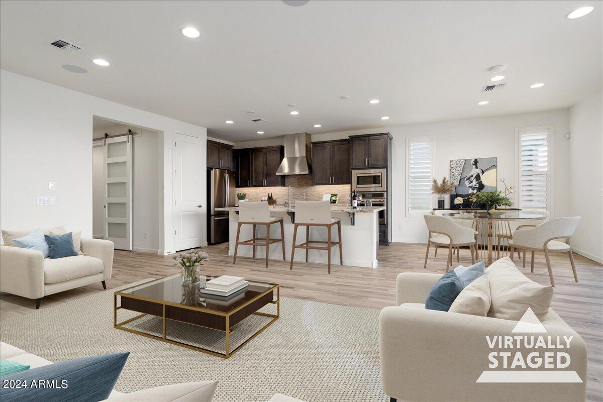 4092 Prairie Schooner Road Wickenburg, AZ 85390 - Photo 2 of 30 a living room with furniture and kitchen view