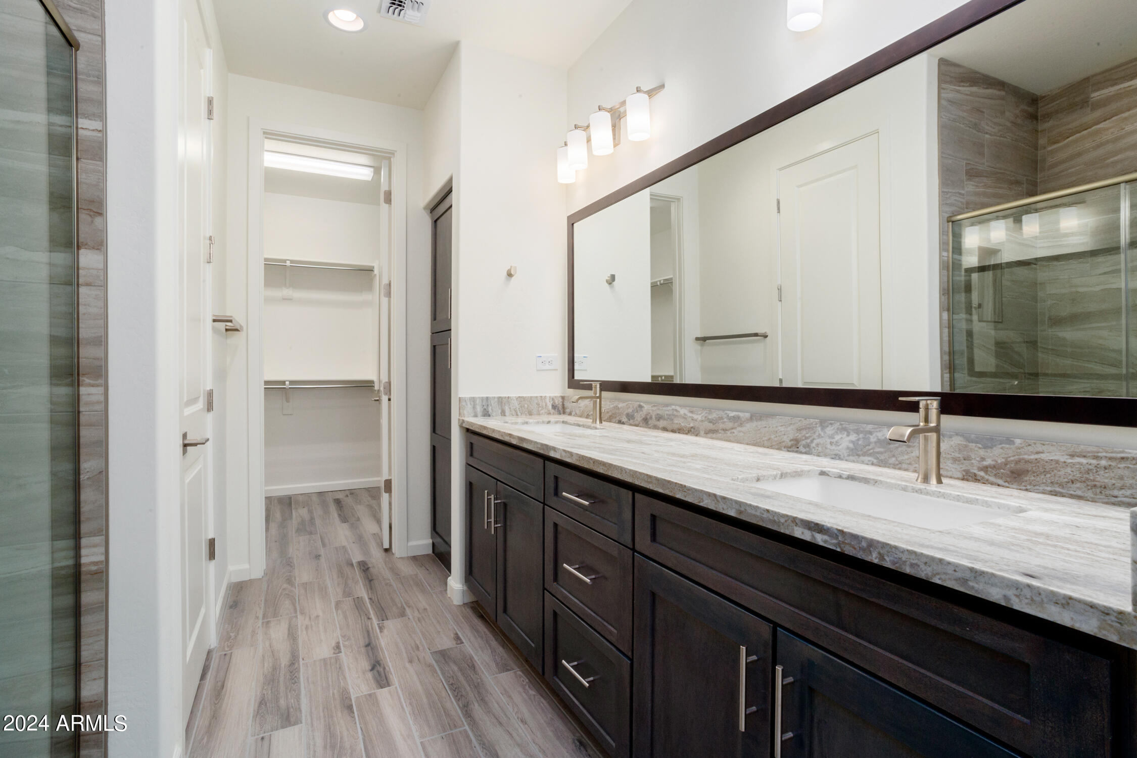 4092 Prairie Schooner Road Wickenburg, AZ 85390 - Photo 22 of 30 a bathroom with a sink and a mirror