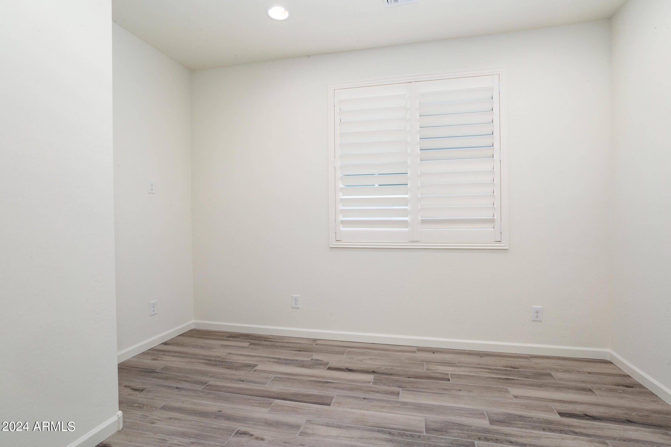 4092 Prairie Schooner Road Wickenburg, AZ 85390 - Photo 28 of 30 a view of a small space with wooden floor and a window