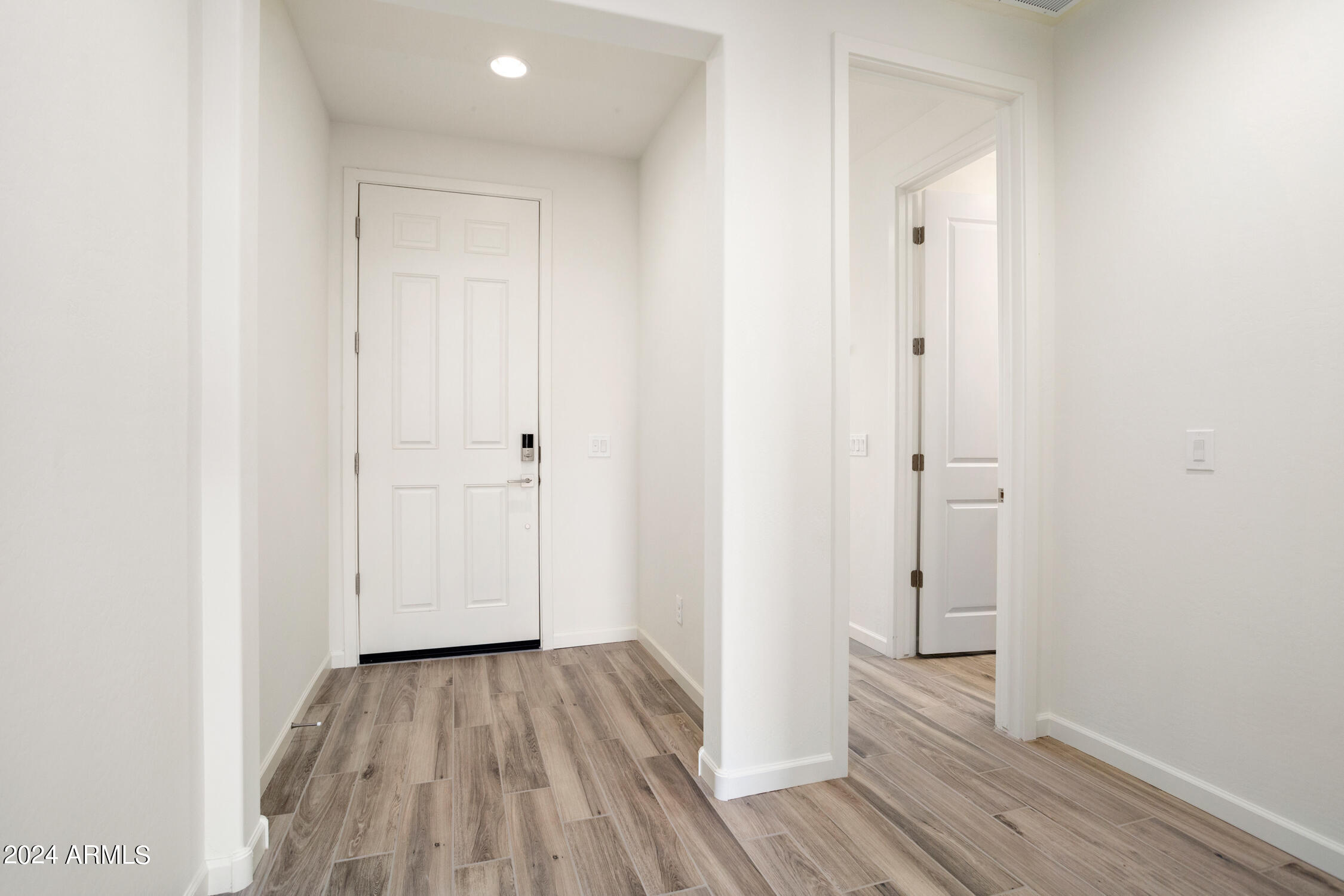 4092 Prairie Schooner Road Wickenburg, AZ 85390 - Photo 8 of 30 a view of a room with wooden floor and a hallway