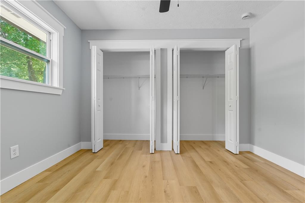 2087 Chestnut Way Lithia Springs, GA 30122 - Photo 23 of 28 an empty room with wooden floor and windows