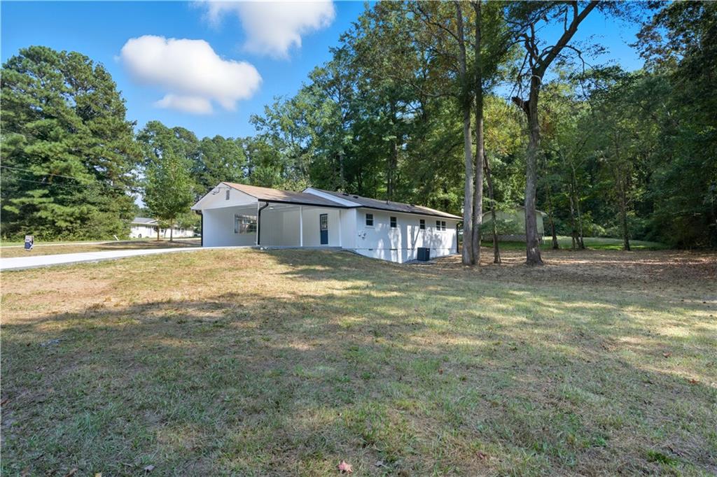 2087 Chestnut Way Lithia Springs, GA 30122 - Photo 3 of 28 a view of a house with swimming pool