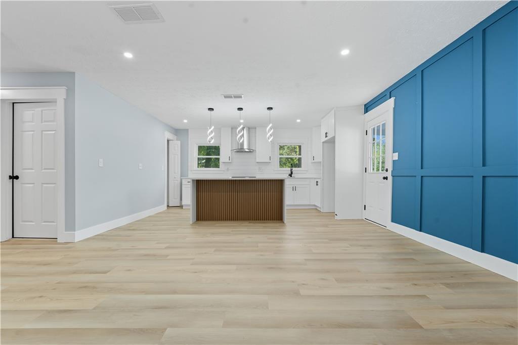 2087 Chestnut Way Lithia Springs, GA 30122 - Photo 7 of 28 a view of an empty room with a kitchen