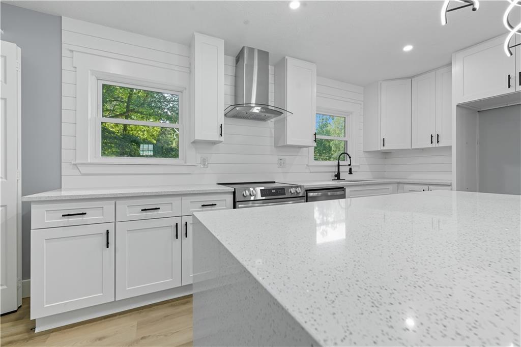 2087 Chestnut Way Lithia Springs, GA 30122 - Photo 9 of 28 a kitchen with a white cabinets and window