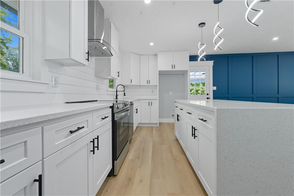 2087 Chestnut Way Lithia Springs, GA 30122 - Photo 10 of 28 a kitchen with cabinets a sink and appliances