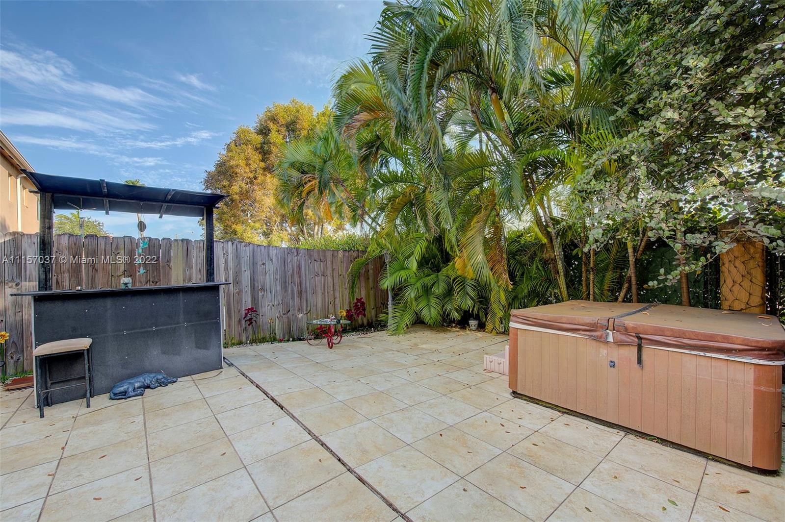 14738 Southwest 9th Lane Miami, FL 33194 - Photo 22 of 30 a view of a backyard with sitting area