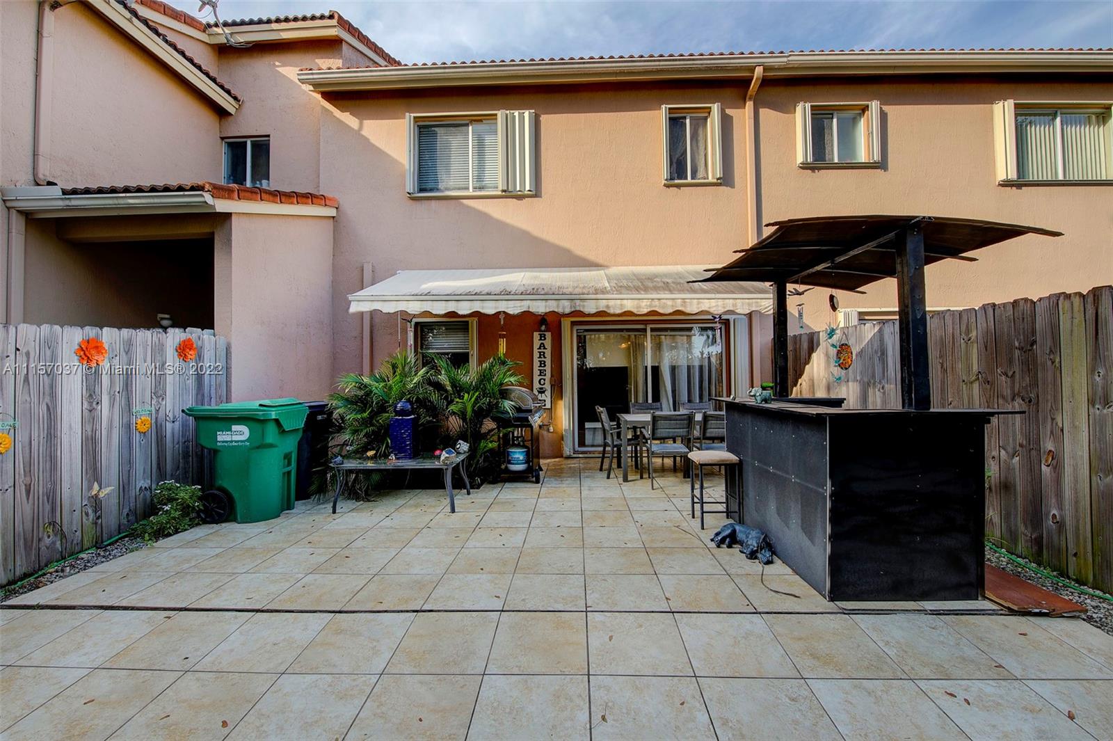14738 Southwest 9th Lane Miami, FL 33194 - Photo 23 of 30 a view of a house with backyard sitting area and garden