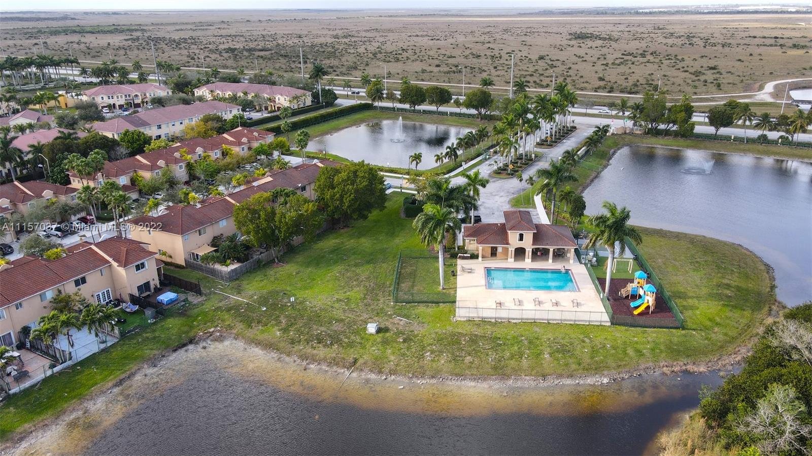 14738 Southwest 9th Lane Miami, FL 33194 - Photo 28 of 30 an aerial view of residential houses with outdoor space and lake view