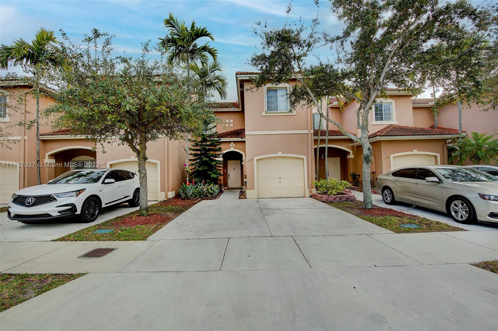 14738 Southwest 9th Lane Miami, FL 33194 - Photo 3 of 30 a view of a car parked in front of a building