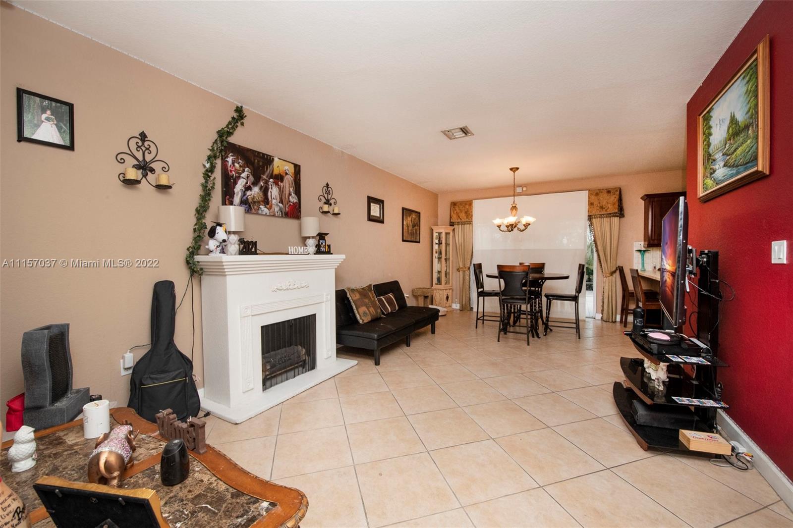 14738 Southwest 9th Lane Miami, FL 33194 - Photo 5 of 30 a living room with furniture and a fireplace
