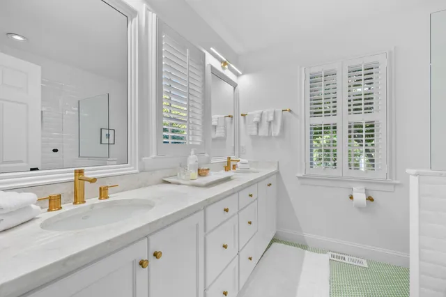a bathroom with a sink and a window