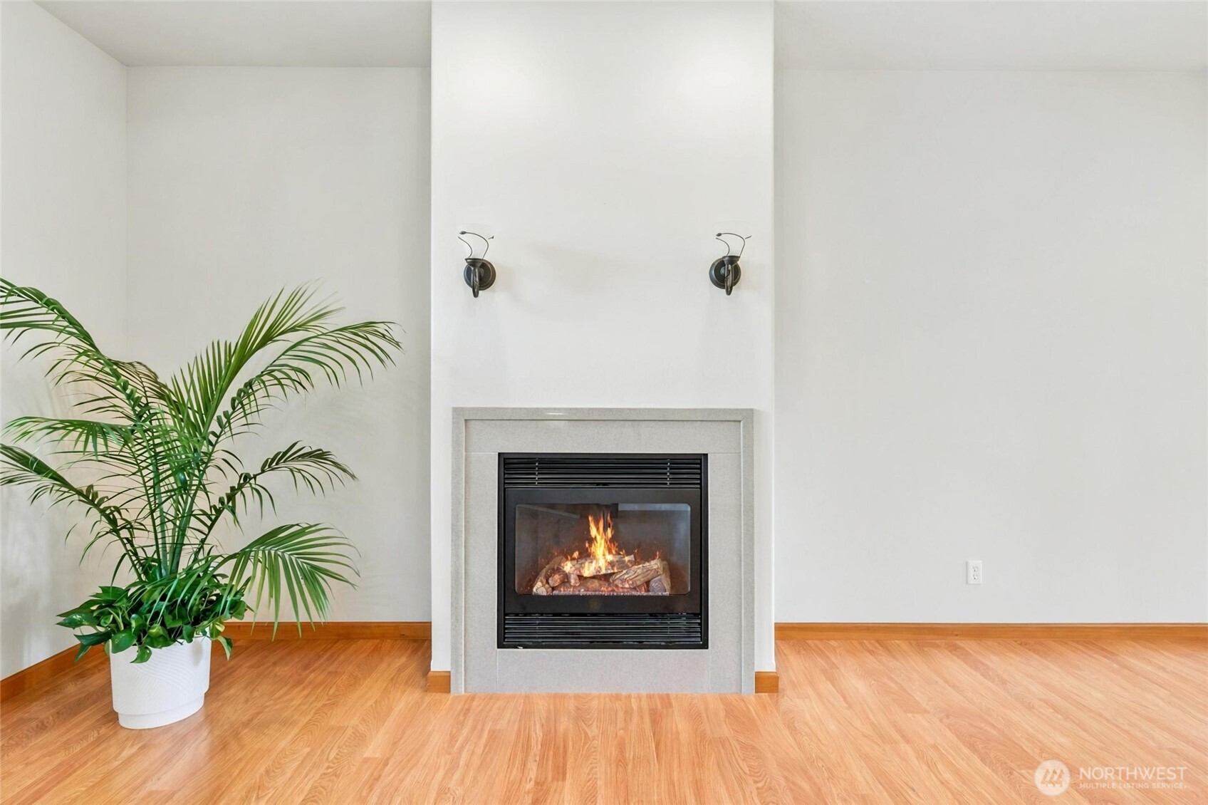 1931 Gemstone Drive Walla Walla, WA 99362 - Photo 12 of 40 a living room with a fireplace and a potted plant