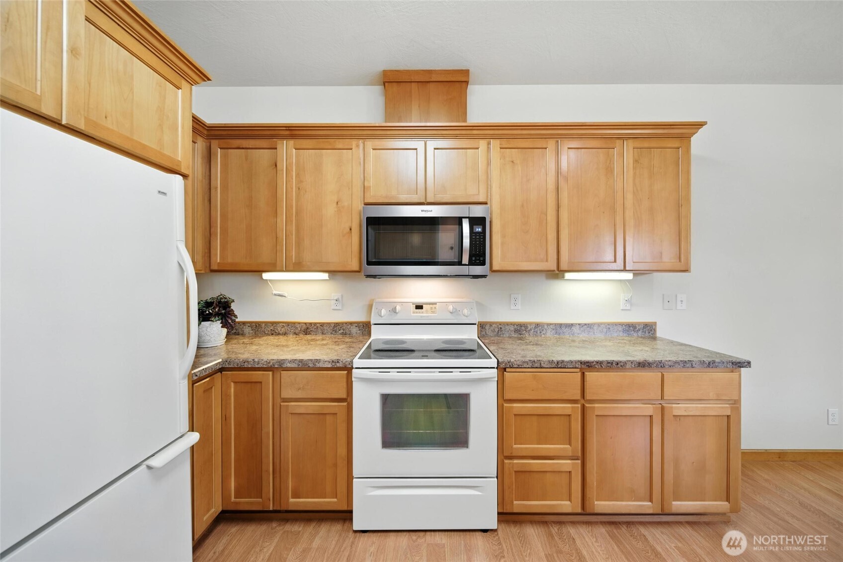 1931 Gemstone Drive Walla Walla, WA 99362 - Photo 16 of 40 a kitchen with granite countertop white cabinets and stainless steel appliances