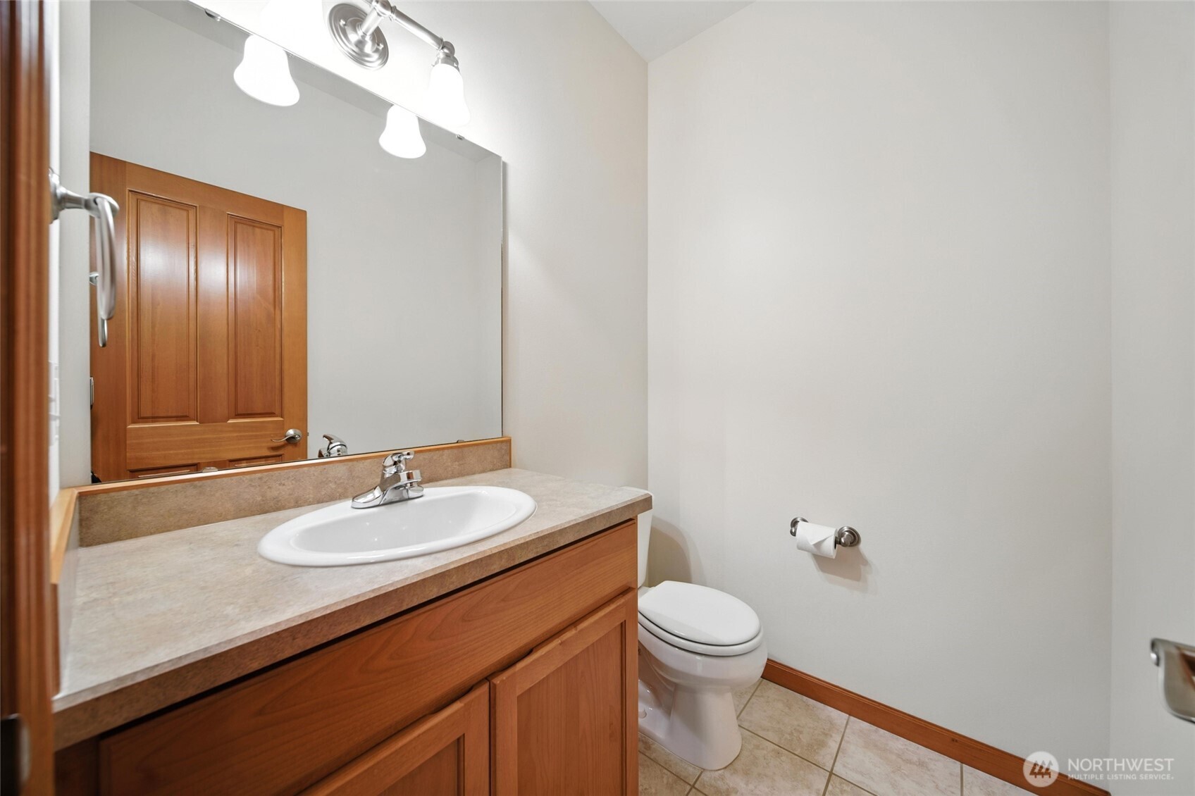 1931 Gemstone Drive Walla Walla, WA 99362 - Photo 21 of 40 a bathroom with a sink a toilet and mirror