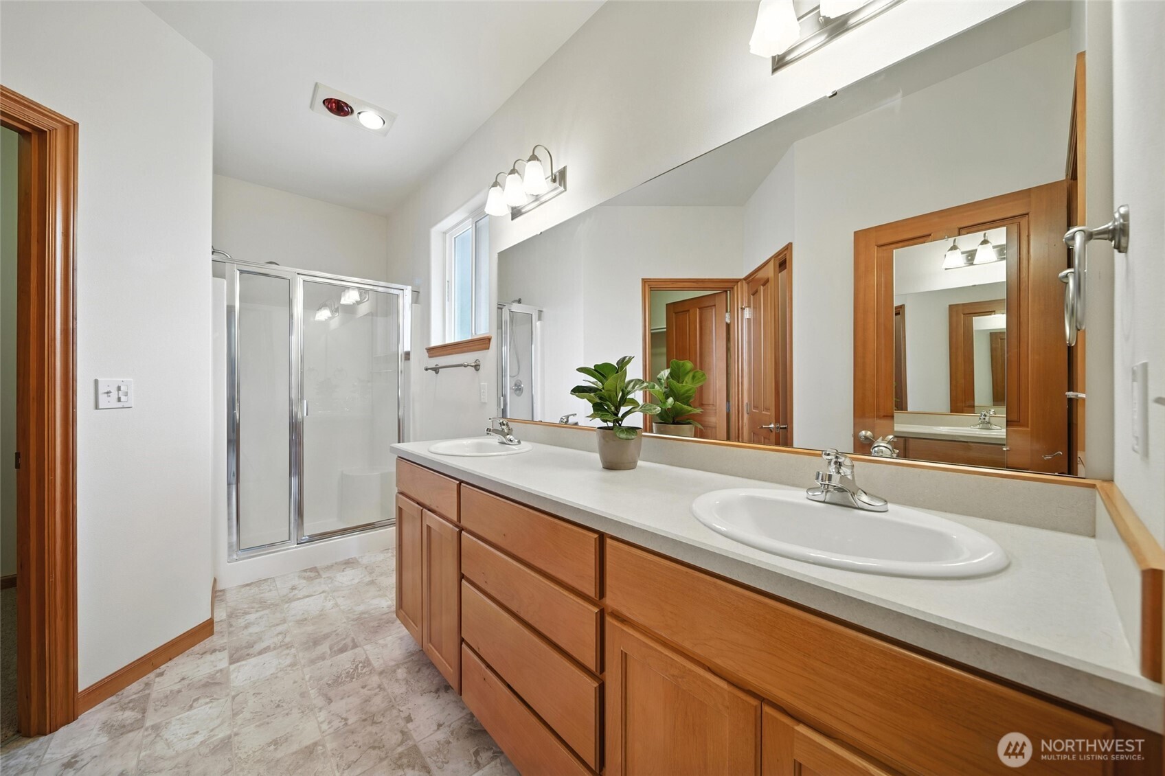 1931 Gemstone Drive Walla Walla, WA 99362 - Photo 25 of 40 a bathroom with a sink double vanity granite and a mirror