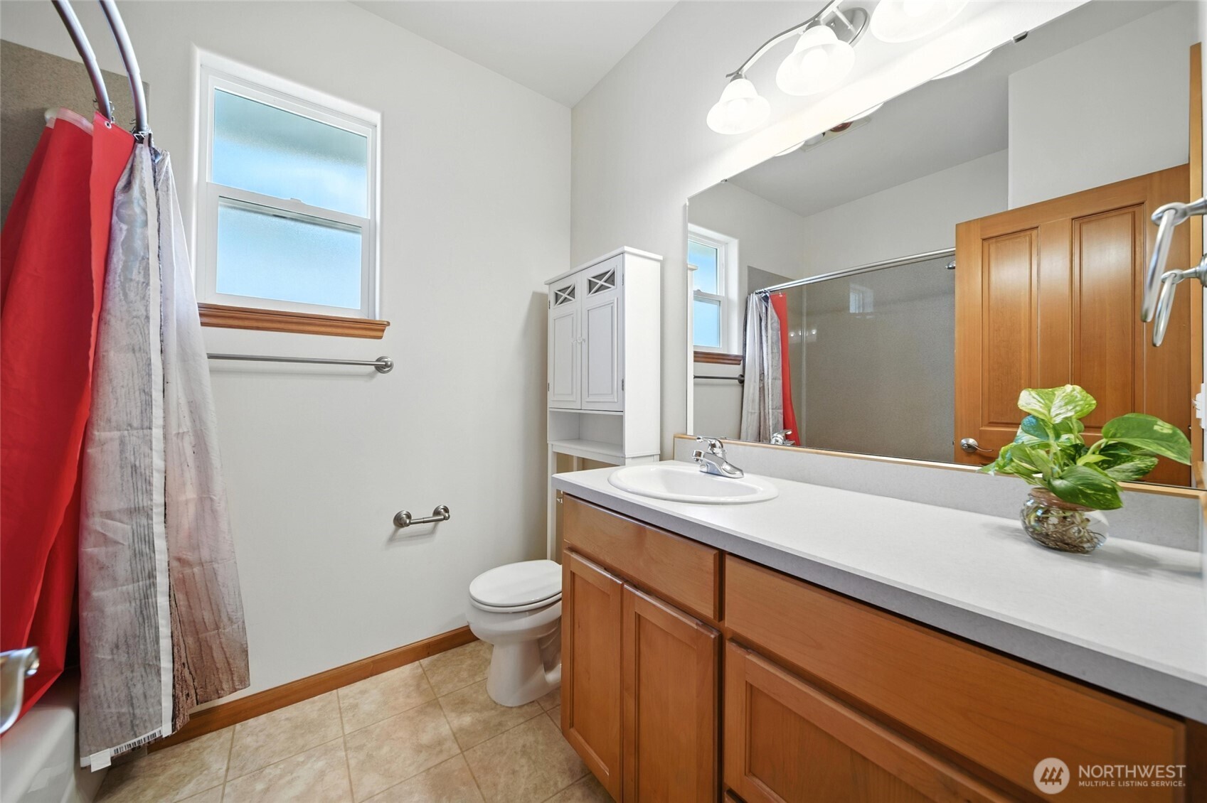 1931 Gemstone Drive Walla Walla, WA 99362 - Photo 29 of 40 a bathroom with a sink a toilet and shower