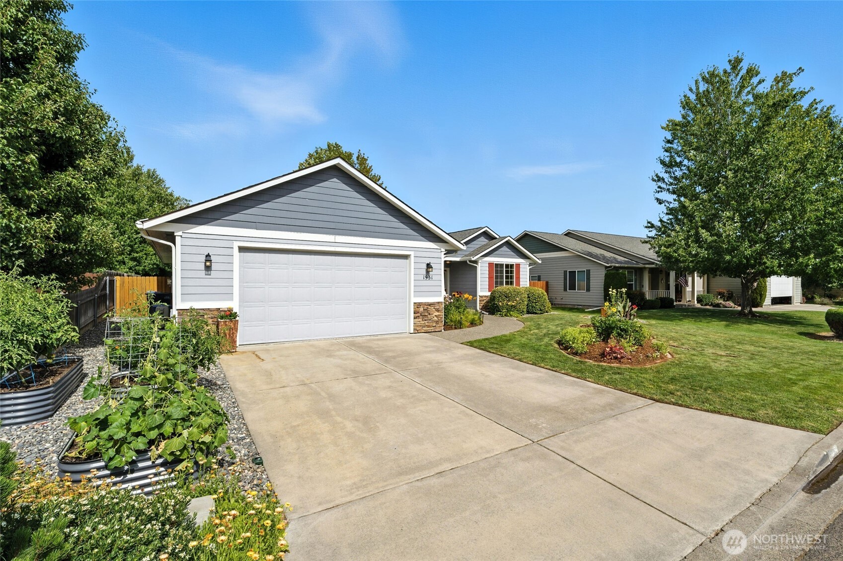 1931 Gemstone Drive Walla Walla, WA 99362 - Photo 3 of 40 a front view of a house with a yard