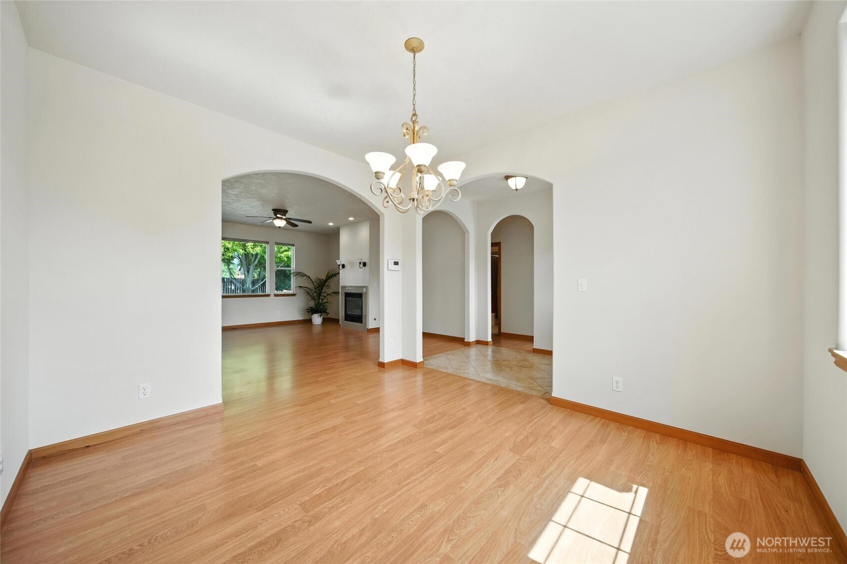 1931 Gemstone Drive Walla Walla, WA 99362 - Photo 9 of 40 a view of a room with wooden floor chandelier and a window