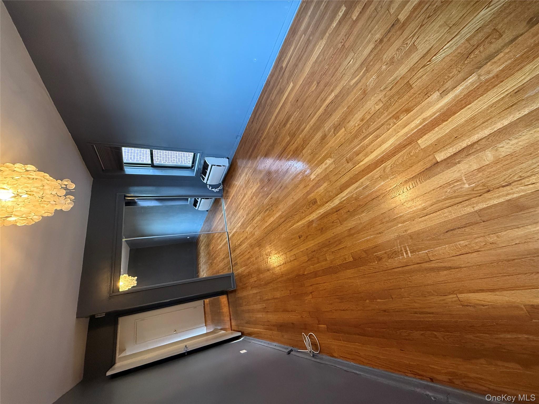 65-15 38th Avenue, Unit 5P Queens, NY 11377 - Photo 11 of 15 a view of a livingroom with a staircase