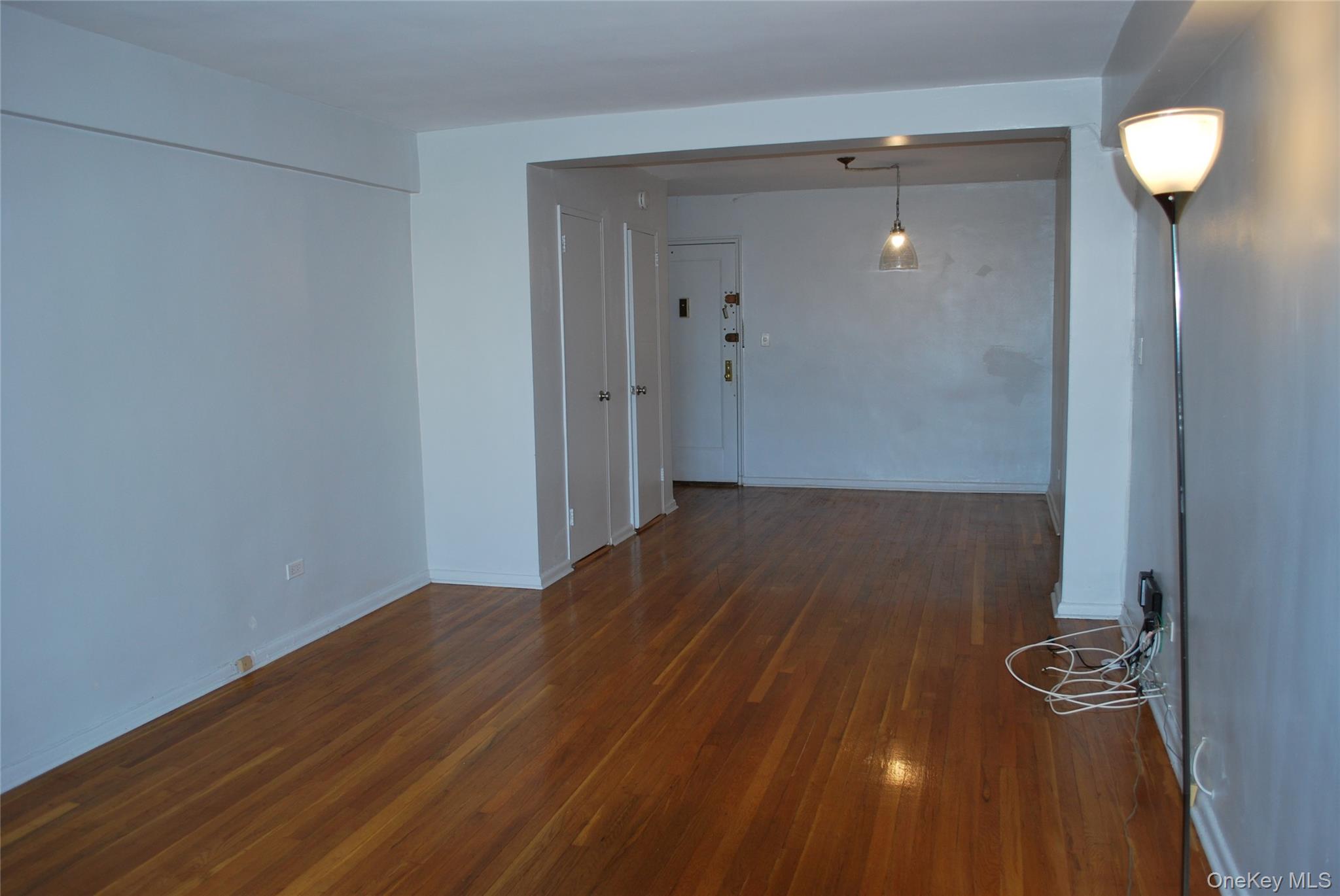 65-15 38th Avenue, Unit 5P Queens, NY 11377 - Photo 5 of 15 wooden floor in a gallery